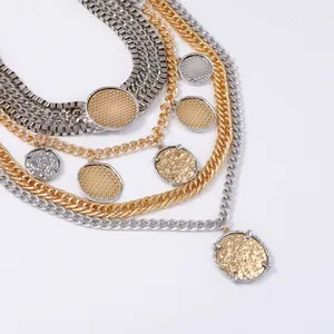 Layered chunky chain necklace set with silver snake chain and gold textured coin pendants