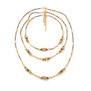 Three-layer gold beaded necklace set with geometric CCB pendants and grey faceted beads