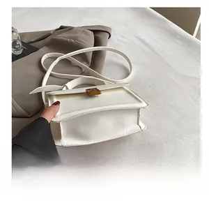 Detailed close-up showing the durable bottom and wear-resistant structure of the white bag