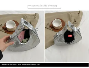 Vue détaillée de l'intérieur du sac matelassé argenté montrant l'espace de rangement chic