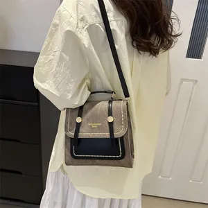 Sac bandoulière vintage avec cuir suédé gris et poignée supérieure en cuir noir
