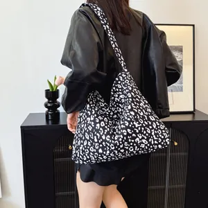 Fashionable leopard print canvas tote bag with wide shoulder strap for casual daily use