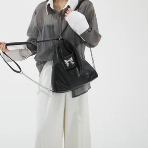 Versatile black soft PU shoulder bag with silver bow detail and stylish chain strap