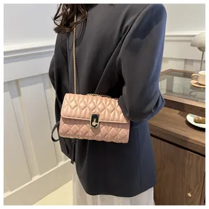 Chic quilted crossbody bag in nude pink with elegant gold chain strap for women