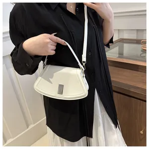 Chic white leather shoulder bag with curved boat design and silver metal buckle detail