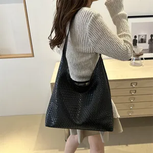 Black woven leather hobo bag with large capacity and minimalist retro shoulder style