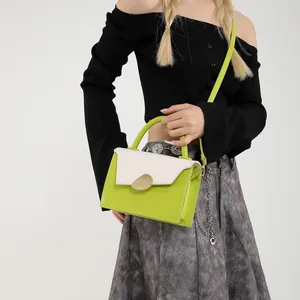 Chic green and cream leather small crossbody handbag for women with gold metal buckle