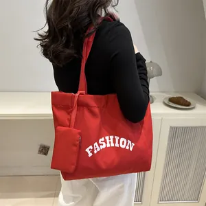 Red large capacity canvas tote bag with FASHION lettering and small zipper pouch