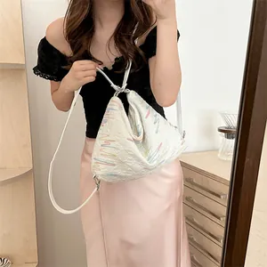 Quilted white shoulder bag with colorful wave embroidery and slim leather strap for women