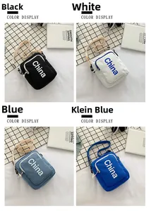 Canvas square crossbody bags displayed in black, white, light blue and Klein blue
