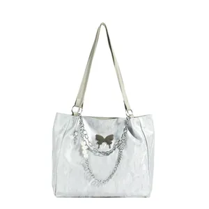 Silver metallic crinkled tote bag with butterfly ornament and pearl chain charms