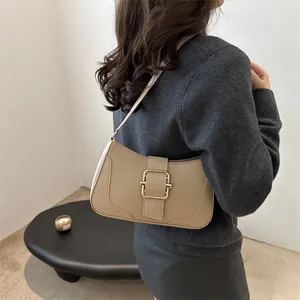 Minimalist apricot underarm bag for women with a vintage golden square buckle strap