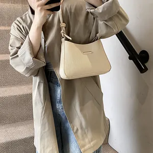 Retro cream white shoulder bag with woven rope strap and gold metal hardware