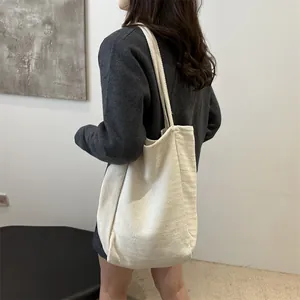 Minimalist cream canvas tote bag with herringbone texture and large capacity for women