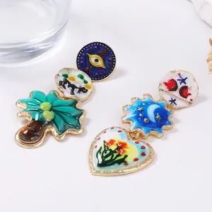 Orecchini bohémien in smalto con sole, luna e occhio in lega dorata dal design artistico