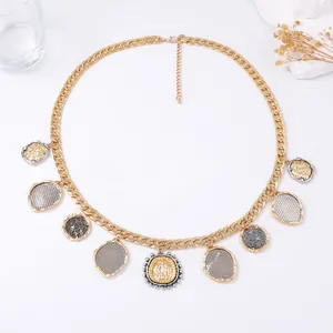 Luxurious gold chain necklace with geometric coin pendants and textured metallic charms