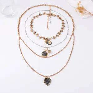 Multilayer gold and silver chain necklace set with heart and round charm pendants