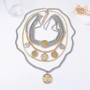 Multi-layer gold and silver mixed chain necklace with vintage coin pendant on white surface