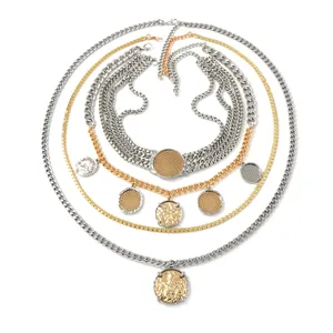 Multi-layer mixed metal chain necklace with vintage coin pendants in gold and silver finish