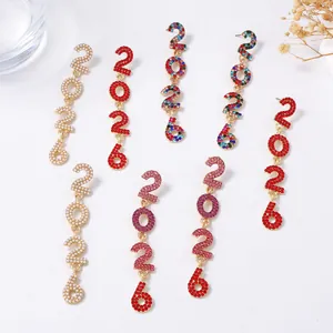 Sparkling 2026 number drop earrings with rhinestones and pearls for New Year celebration