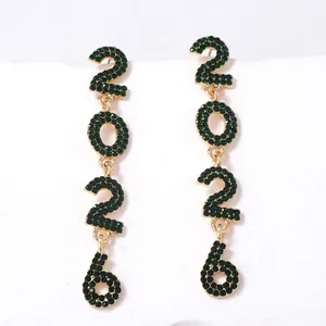 Detailed view of long gold alloy earrings with green crystal 2026 number pendants