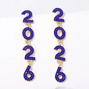 Detailed view of 2026 number drop earrings with blue rhinestones and gold alloy