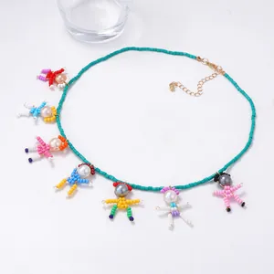 Handmade beaded necklace featuring colorful cartoon pearl figure pendants on turquoise beads