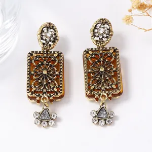 Vintage palace style geometric floral drop earrings with rhinestones and amber resin