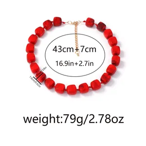 Detail shot of red marble resin square beads necklace with gold adjustable extension chain