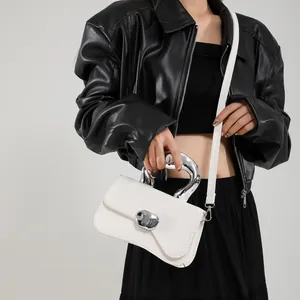 Chic white square crossbody bag with a unique silver sculptural metal handle for women