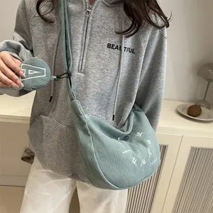 Large mint green corduroy crescent tote bag with matching round coin purse pouch