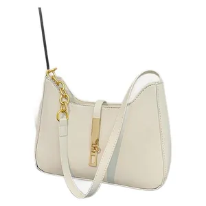 Minimalist cream leather crescent hobo bag with gold metal chain and J-shaped buckle