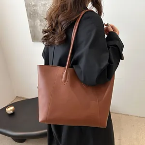 Classic brown large tote bag for women in a minimalist retro design for daily commuting