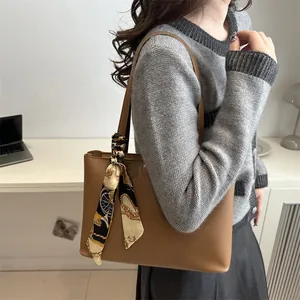 Retro brown leather tote bag with elegant decorative silk scarf for women's office wear