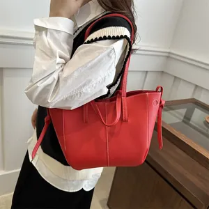 Red lychee grain PU leather tote bag with white contrast stitching and dual top handles