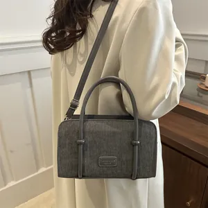 Chic gray corduroy handbag for women with dual handles and adjustable shoulder strap