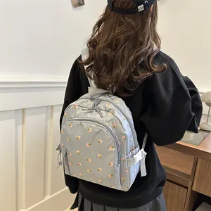 Cute light blue floral mini backpack for women with adjustable straps and multiple pockets