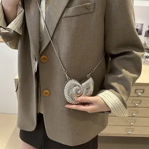 Silver nautilus shell crossbody bag with metallic finish and delicate pearl chain strap