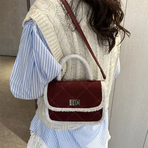 Chic burgundy quilted crossbody bag with white shearling trim and gold clasp