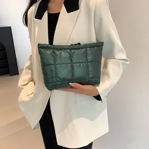 Deep green quilted puffer handbag with a trendy square stitching design for women
