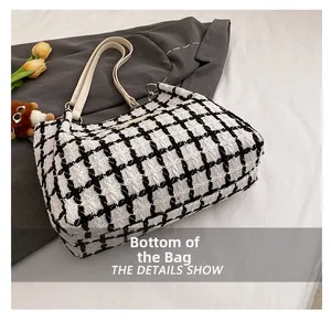 Macro detail of the thickened bottom base of the black and white checkered tote bag