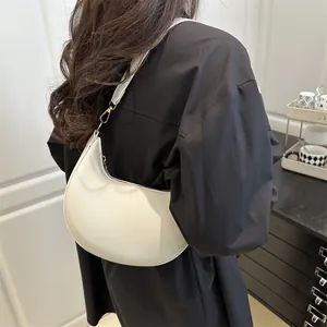French style white crescent shoulder bag with pebbled leather texture and gold hardware
