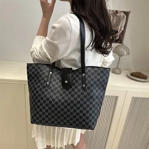 Retro grey tote bag with M-pattern print and long black straps for stylish daily commute