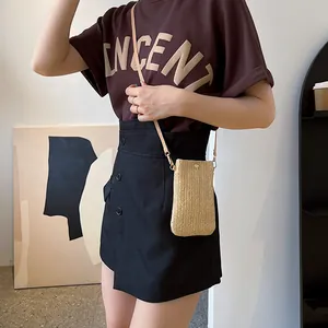 Straw woven crossbody phone bag with sunflower design and chic beige herringbone pattern