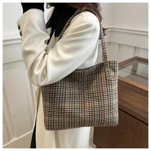 Macro detail of the retro plaid fabric texture and woven pattern on this large tote bag