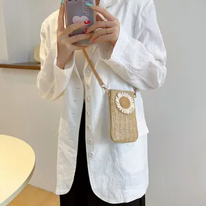 Handmade straw crossbody bag with sunflower detail and leather strap for women