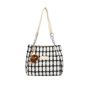 Checkered tweed tote bag with leather straps and plush monster charm for women