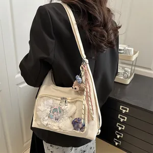 Off-white large capacity Ita bag with transparent PVC window and plush bear charm