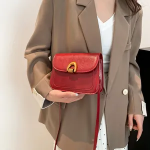 Vintage dark red saddle shoulder bag for women with gold horseshoe metal buckle