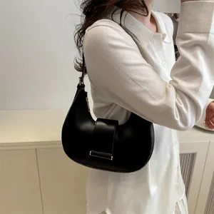 Chic black matte leather crescent underarm bag for women with sleek metal buckle detail